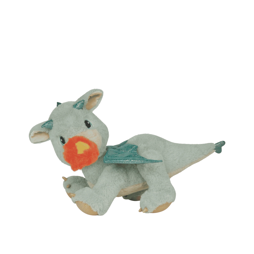 The Olli Ella Dinkum Dragon - Blaze - Green is a soft plush dragon toy with teal wings, teal horns, tan feet, and a red-orange flame held in its magnetic mouth, shown against a white background.