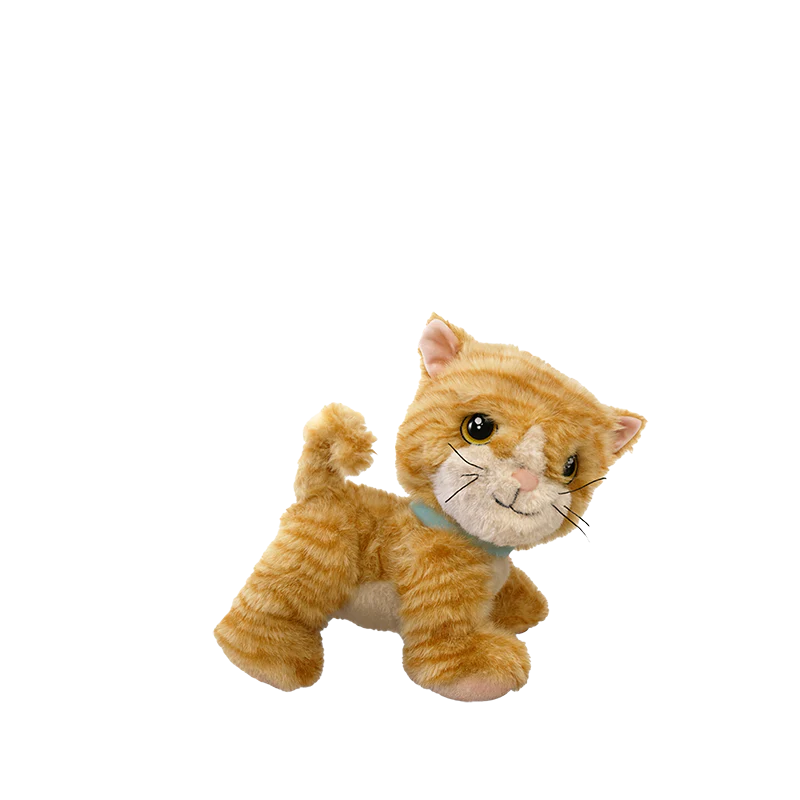 The Olli Ella Dinkum Cat Binx - Ginger features orange and cream stripes, a light blue collar, and a friendly expression, standing against a plain white background.