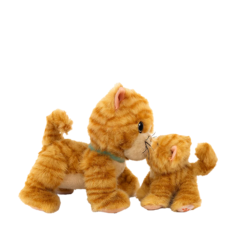 Two Olli Ella Dinkum Cat Binx - Ginger plush toys, one large and one small, with orange and white stripes, blue collars, and curled tails, nuzzle each other for interactive play against a plain white background.
