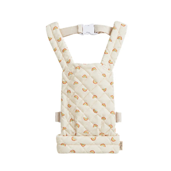 Olli Ella Quilted Doll Carrier - Rainbow, in beige with a charming rainbow pattern and adjustable straps, displayed on a white background.