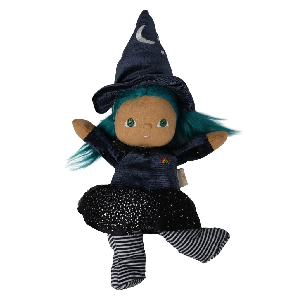 Olli Ella Dinky Dinkum Doll - Winnie Witch dressed in a dark blue hat with a crescent moon, a matching dress with a rainbow emblem, and black and white striped leggings.
