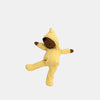 The Olli Ella Dozy Dinkum - Mini is a soft cotton doll with brown skin in a yellow hooded onesie, arms and legs outstretched against a plain light background—ideal as baby’s first toy.
