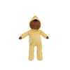 Olli Ella Dozy Dinkum - Mini: a plush doll with brown skin, closed eyes, black hair, and a calm face, dressed in a yellow hooded onesie with a rainbow motif. Made from soft cotton—perfect as baby's first toy. Shown on a plain white background.