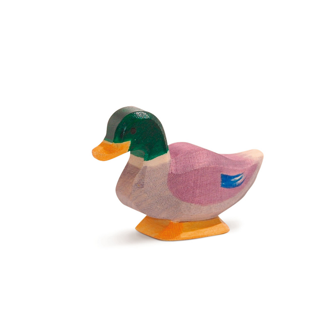 The Ostheimer Duck is a small, handcrafted wooden figurine with a green head, yellow beak, and multicolored body—perfect for anyone who loves collectible wooden toys.