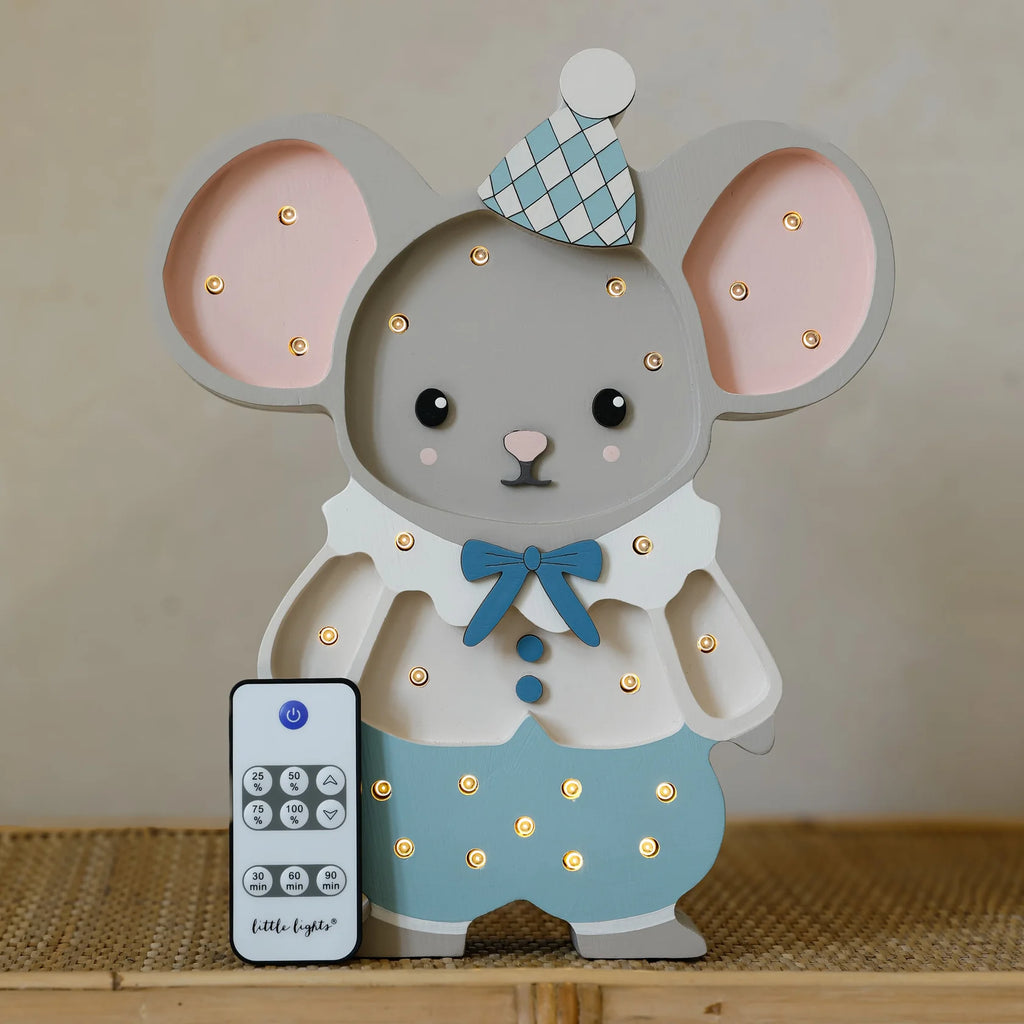 The Handmade Wooden Lamp - Felix The Mouse features a cute mouse in a clown hat and outfit with gentle glowing lights. Standing on a woven surface, it includes a remote control and is perfect as nursery decor.
