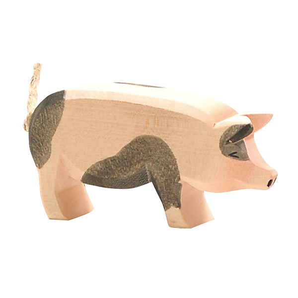 The Ostheimer Spotted Pig - Head High is a handcrafted wooden figurine with light pink and gray patches, a curled tail, and simple features—ideal for imaginative play or as part of your Ostheimer toys collection.