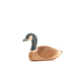 Handcrafted in Germany, this wooden Ostheimer Canada Goose - Swimming is depicted in a swimming position.