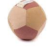 The Fabric Ball - Dusty Rose is a soft organic cotton baby ball with stitched beige, pink, and light brown panels and a small fabric tag—perfect as a gentle developmental toy for little ones.