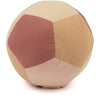 The Fabric Ball - Dusty Rose is made of soft organic cotton panels in harmonious shades, creating a gentle patchwork pattern that serves as a safe and developmental toy for babies.