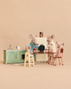 Four Maileg mice having breakfast with a Maileg Family Breakfast Set, including a miniature kitchen, a waffle iron, and food accessories.