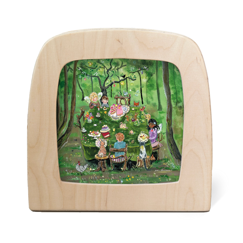 The "Silhouette Only - Forest Tea Party" design depicts a tea party scene in a forest, with animals and children gathered around a table laden with cakes and tea. Enclosed by magic silhouettes within a wooden frame, it evokes a cozy, storybook charm amid lush greenery and garlands.