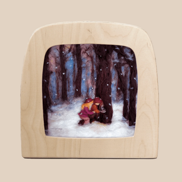 The Silhouette Only - Winter Discoveries for Toverlux Lamp features felt art of two children in winter coats gathering sap from a tree in a snowy forest, their shapes rendered in silhouette among tall trees and gentle snowflakes.