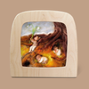 The Silhouette Only - Budding Spring for Toverlux Lamp features a felt artwork encased in a wooden frame, showcasing tiny human-like figures asleep beneath a tree with cascading roots. Made from food-grade safe materials, the scene is vibrant with earthy shades of brown, orange, and green, cultivating a tranquil and dreamy atmosphere.