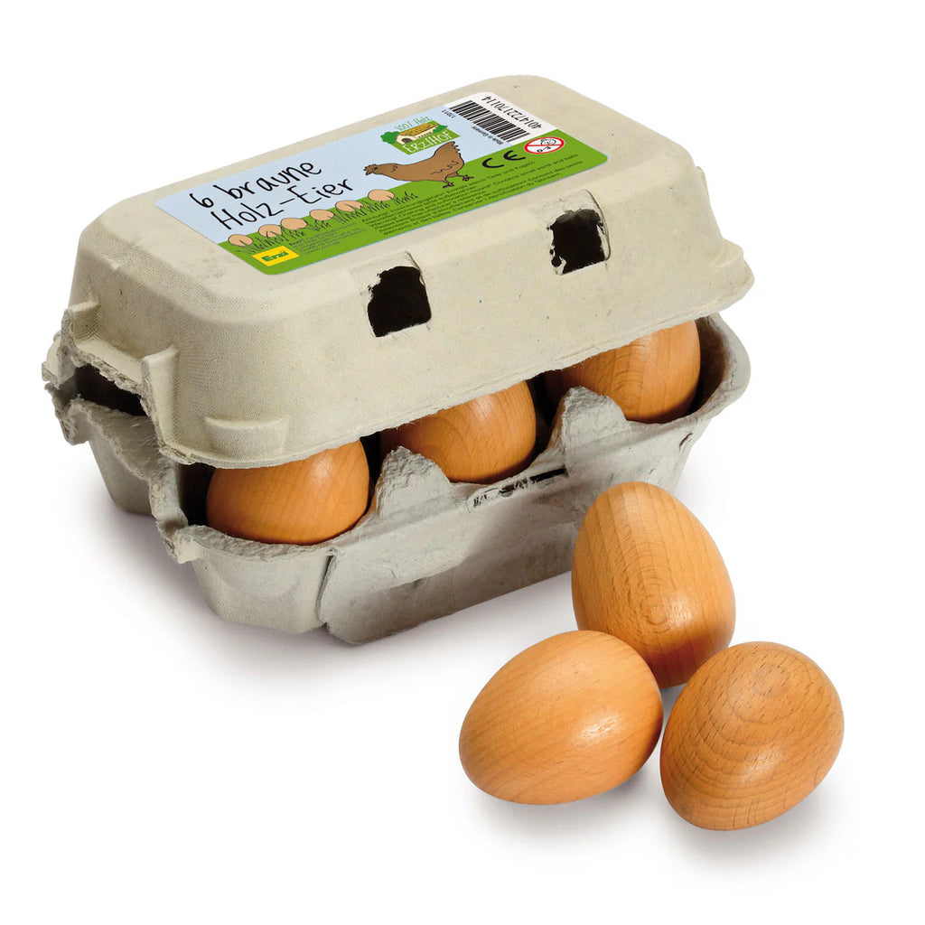 The Erzi Half A Dozen Wooden Eggs set features a cardboard egg carton containing six realistic-looking wooden play eggs, with three eggs displayed outside the carton on a white background—an ideal addition to any pretend kitchen toy collection.