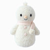 The Cuddle + Kind Baby Snowman - Blush is a fair trade plush toy featuring a soft, fuzzy texture, black eyes, an orange nose, and a pale pink scarf—ideal for stuffed animal lovers and winter decor.