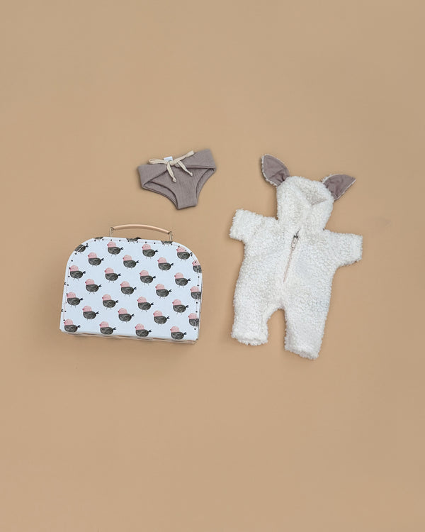 The Minikane 11" Doll Clothing Jeannot Jumpsuit & Diaper in Suitcase Set features cozy terrycloth cotton pieces and a cute small suitcase, perfect for styling your doll with comfort and charm.