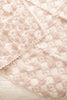 The Organic Cotton Baby Patchwork Blanket - Pink Bows features a soft pink and white design with embroidered diamond patterns and small bows, neatly draped on a bed. Ships in one week.