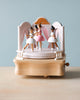 The wooden ballerina music box photographed in a different angle, showing various profiles of the ballerinas.
