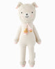 Cuddle + Kind Lola the Llama is a soft, hand-knit cream-colored doll featuring pink cheeks, tassels, and pink details on its ears, hands, and feet—a delightful fair trade toy for all ages.