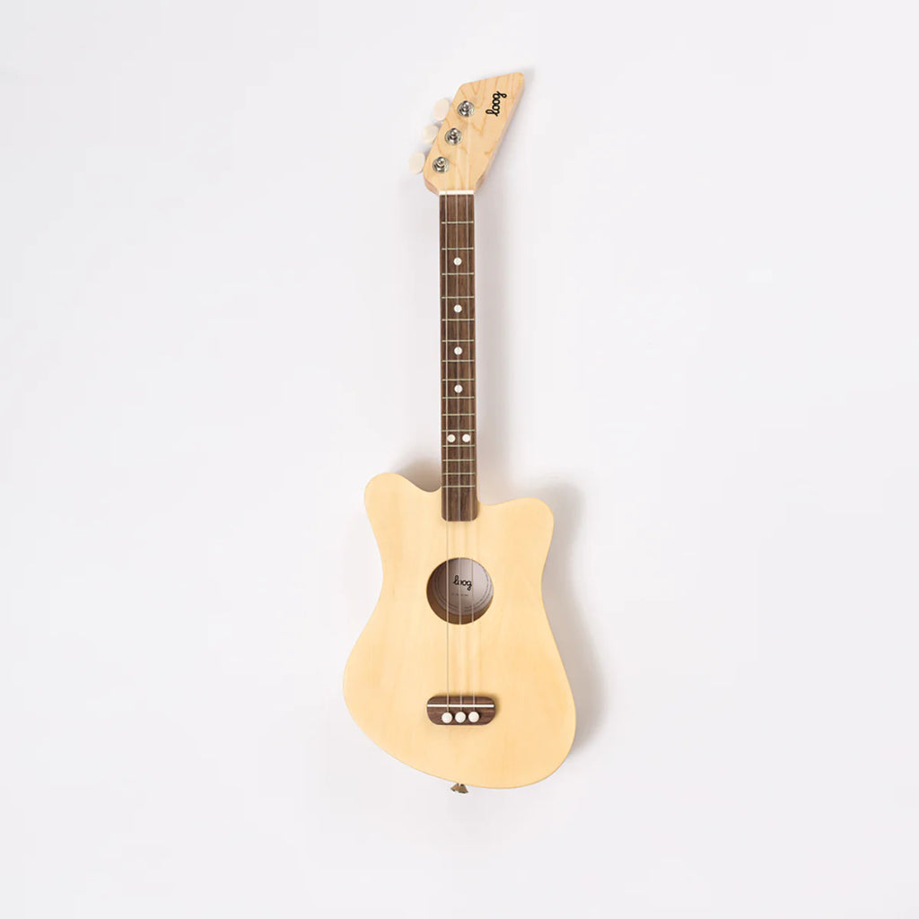 A wooden kid's guitar in natural finish.