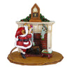 The Wee Forest Folk Tiny Collectible - A Visit From St. Nick features a hand-sculpted mouse dressed as Santa, reaching into a green stocking by a decorated fireplace with classic holiday details.