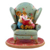 The Wee Forest Folk Tiny Collectible - Sharing A Story features a hand-sculpted mouse duo in a floral armchair, reading together atop a red patterned rug—a delightful miniature figurine.