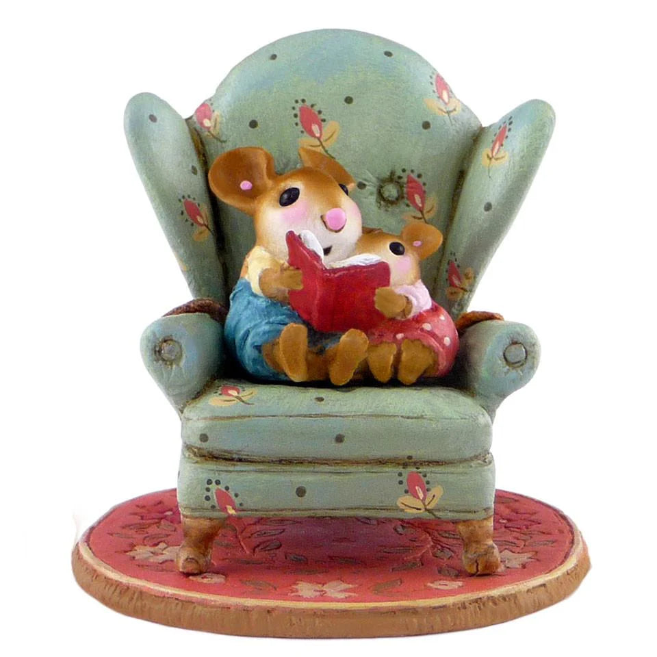 The Wee Forest Folk Tiny Collectible - Sharing A Story features a hand-sculpted mouse duo in a floral armchair, reading together atop a red patterned rug—a delightful miniature figurine.