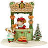 The Wee Forest Folk Tiny Collectible - A Gingerbread Christmas features a festive mouse in a red hat selling cookies from a “Ginger Bread” stand to another mouse with a cookie sled, plus a snowy tree for holiday charm.
