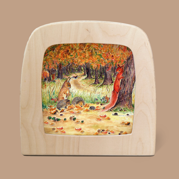 The Silhouette Only - Autumn Bliss Silhouette for the Toverlux Lamp features a charming illustration of a red squirrel on a forest floor with orange leaves beside a large tree, accompanied by another animal amidst acorns and fallen leaves, forming an enchanting autumn scene.