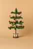 The PRE-ORDER: Maileg Christmas Tree, Mouse Size (Approx. Ship Date: Early October), features red baubles and miniature LED bulbs on a round, decorative base, shown against a plain beige background.