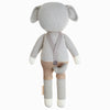 Cuddle + Kind Noah the Dog is a hand-knit doll resembling a gray dog, shown from the back, in tan shorts with suspenders, a small tail, cream paws, and floppy ears.
