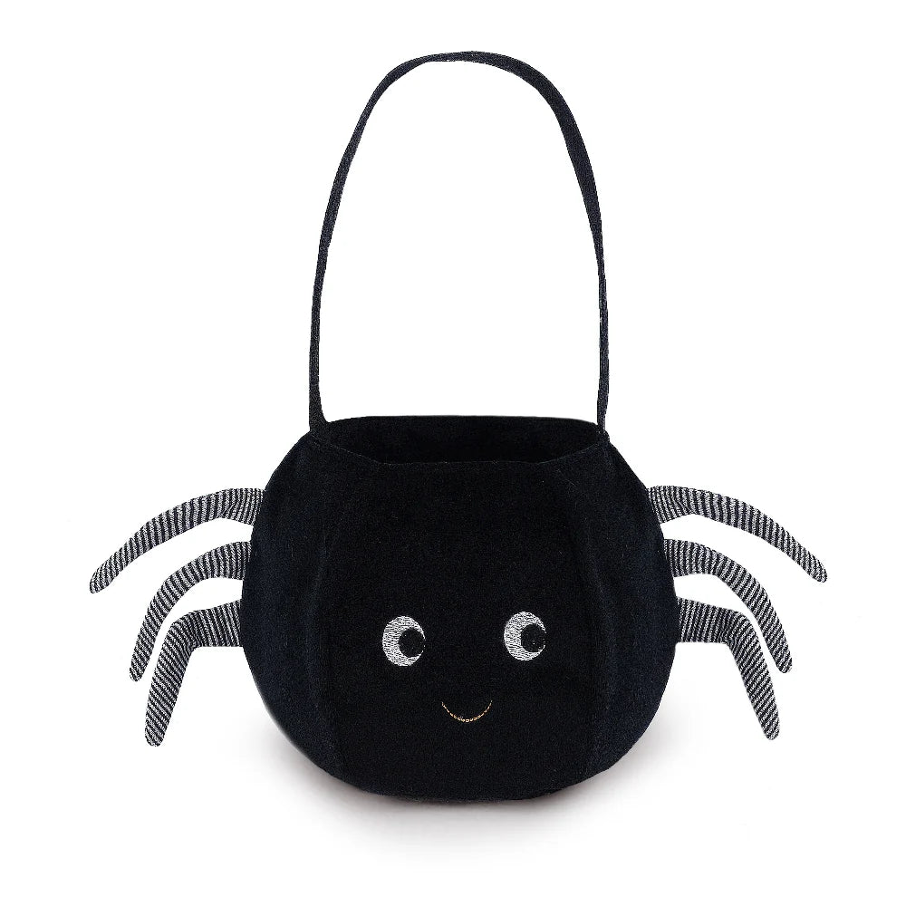 The Mon Ami - Spider Halloween Bag is a black trick-or-treat bag shaped like a spider, featuring striped legs, a sturdy handle, and a smiling face with two large eyes—perfect for carrying treats on Halloween night.