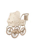 The Konges Sloejd Mini Doll Pram - Lemon is a charming vintage-style pram featuring a beige quilted fabric canopy adorned with small decorative patterns. It comes with large brown wheels, a sturdy metal frame, and a cushioned storage basket for added convenience. (Ships in approximately one week.)