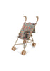 The Konges Sloejd Doll Stroller - Fiola is a lightweight stroller in tan with curved handles and a floral Fiola print fabric seat, pictured on a white background.