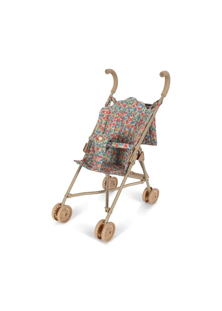 The Konges Sloejd Doll Stroller - Fiola is a lightweight stroller in tan with curved handles and a floral Fiola print fabric seat, pictured on a white background.