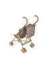 The Konges Sloejd Doll Stroller - Fiola features a beige frame with curved handles, four sets of double wheels, and a colorful floral Fiola print fabric seat and backrest, displayed on a white background.