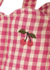 Close-up of the Konges Sloejd Doll Lift - Bubblegum Check, featuring pink and white checkered cotton fabric with two red cherries and green leaves embroidered on it.