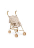 The Konges Sloejd Doll Stroller - Verona Blues features curved handles, four double wheels, and a fabric seat with a small, colorful floral print pattern in beige tones.