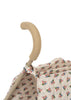 Close-up of the Konges Sloejd Doll Stroller - Verona Blues, featuring a beige foam handle, double wheels, and a vibrant circular floral-patterned fabric—ideal for adding style to doll outings.