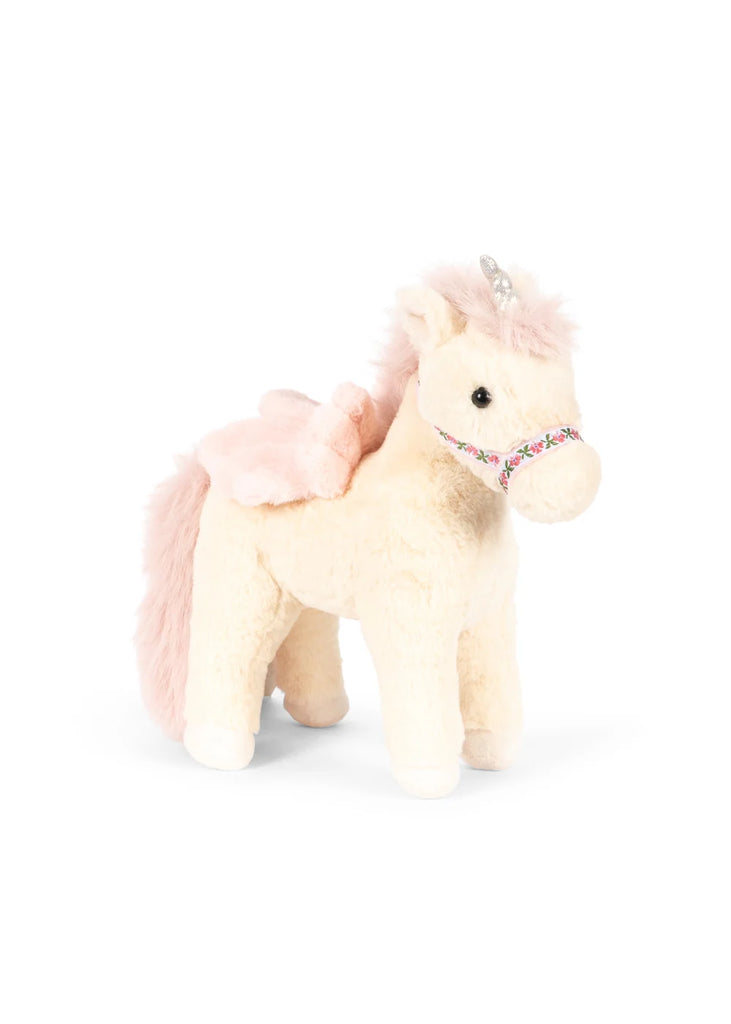 Konges Sloejd Starlight Unicorn Stuffed Animal: A plush, cream-colored unicorn soft toy featuring a pink mane and tail, small silver horn, floral bridle, and shimmering pink wings.