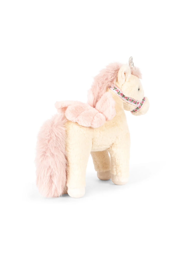 Introducing the Konges Sloejd Starlight Unicorn Stuffed Animal, featuring a soft cream-colored body, a pink fluffy mane and tail, delicate pink wings, and a shimmering horn. This enchanting plush unicorn is adorned with a decorative floral collar and stands proudly on all four legs, making it the perfect cuddly companion for imaginative play.