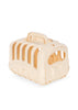 Take your mini toy animal or plush toy on adventures in style with the Konges Sloejd Take Care of Me Animals - Bunny carrier—a beige plastic pet carrier featuring a top handle, side ventilation slits, and a charming bow pattern on the front door.