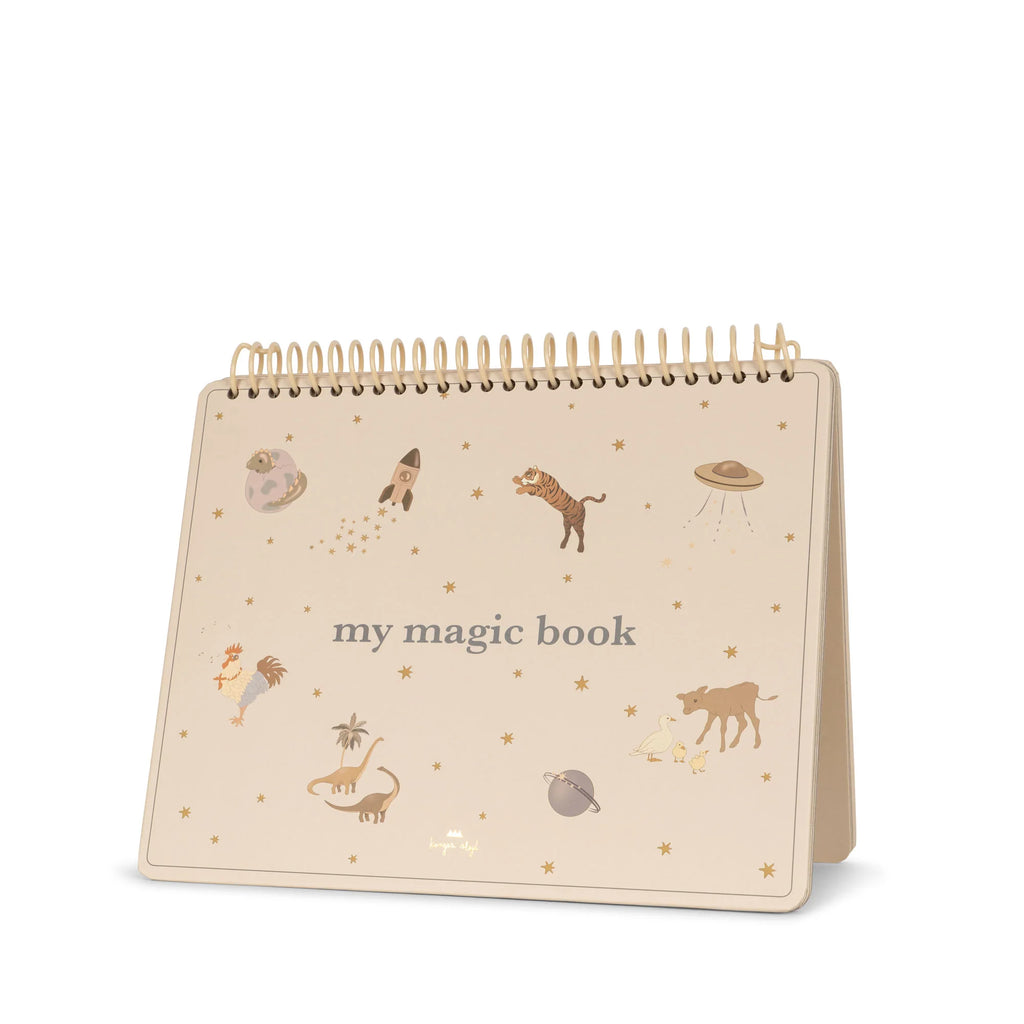 Image of a spiral-bound, stand-up calendar with a beige cover titled "My Magic Water Book - Sleet." The cover, reminiscent of a Magic water coloring book, features illustrations of whimsical animals, planets, stars, and a UFO, creating an enchanting and playful design.