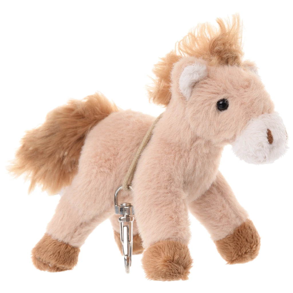 Introducing the Bukowski - Pony Sugar Bag Charm: a small, plush toy horse featuring soft light brown fur, a fluffy mane and tail, brown hooves, and a silver clip on its side—perfect as an adorable pony charm for your backpack or keychain.