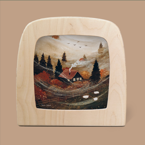A cozy cabin nestled in a foggy, autumn landscape with vibrant orange and red trees. Smoke rises gently from the chimney like a Silhouette Only - October Cottage Silhouette for Toverlux Lamp, while two sheep graze nearby. Framed by a wooden arch, and exuding rustic charm, the scene feels enchanted.