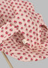 Close-up of the Konges Sloejd Doll Bouncer - Rosie Rose, featuring a pink quilted fabric seat cover with red floral patterns, stitched strap, and fabric tag—perfect for a cozy, stylish doll bouncer.