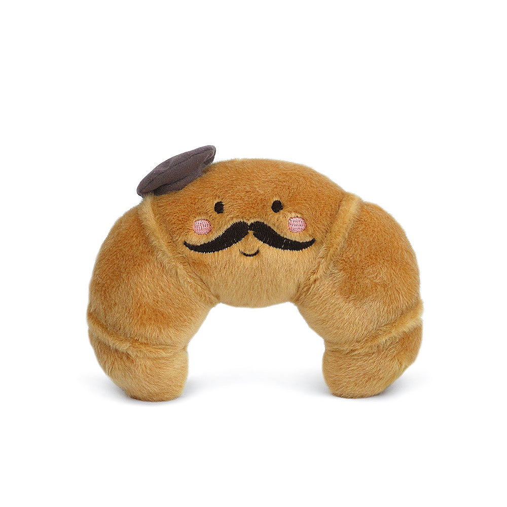 Meet the Monsieur Croissant Plush Toy—a soft croissant plush with a smiling face, pink cheeks, a black mustache, and brown beret. This adorable Mon Ami stuffed animal is perfect for cuddling or gifting.