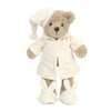The Mon Ami - Briar Bedtime Bear Plush Toy stands upright in a cream-colored nightcap, matching robe, and bunny-faced slippers against a white background—an adorable companion for bedtime.