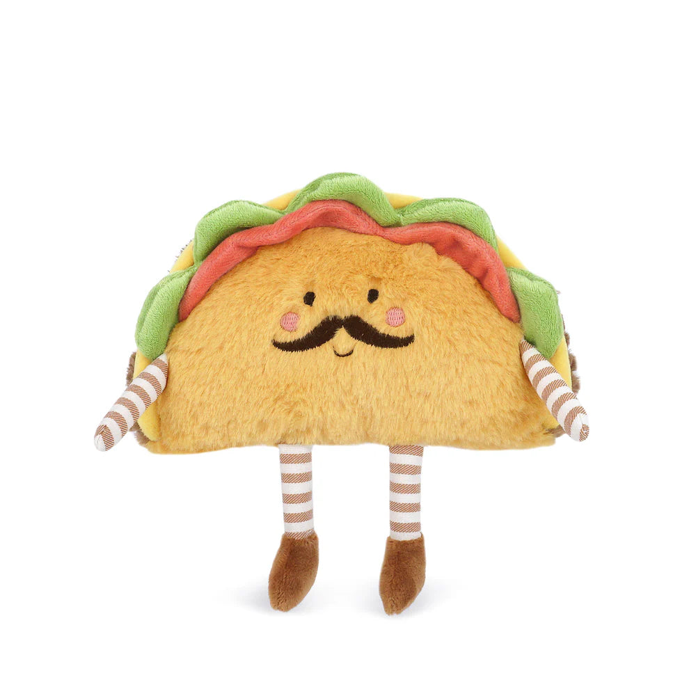 The Paco Taco Plush Toy features a smiling taco with a mustache, rosy cheeks, striped limbs, and colorful felt toppings, shown on a white background.