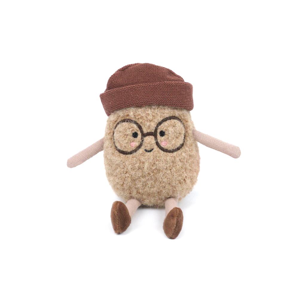 The Spud Bud Potato Plush Toy features brown glasses, a red-brown beanie, pink cheeks, and simple arms and legs. Sitting upright against a white background, it’s the perfect cuddly gift for all ages.